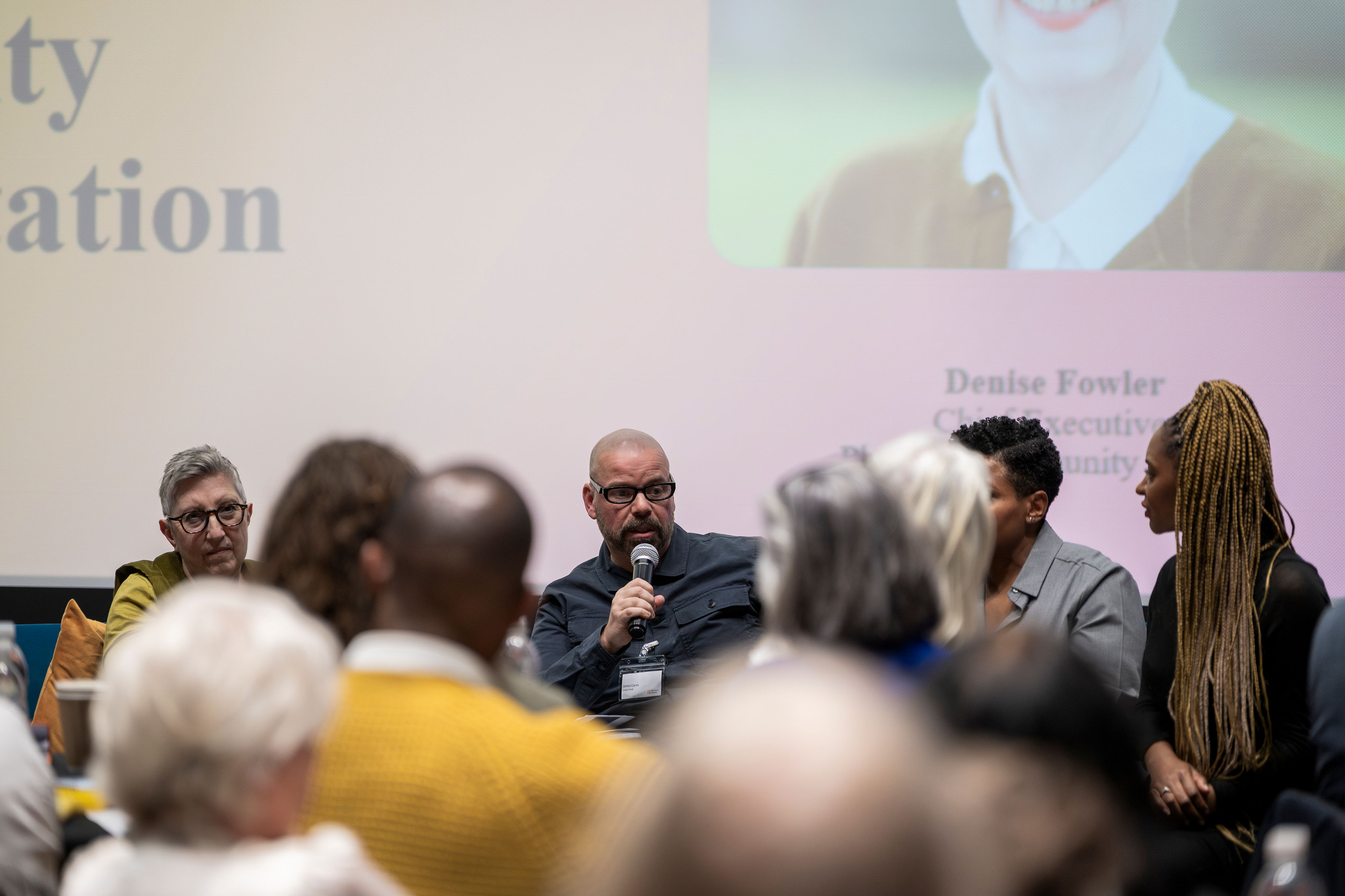 James speaking during a panel session at Inclusive Futures