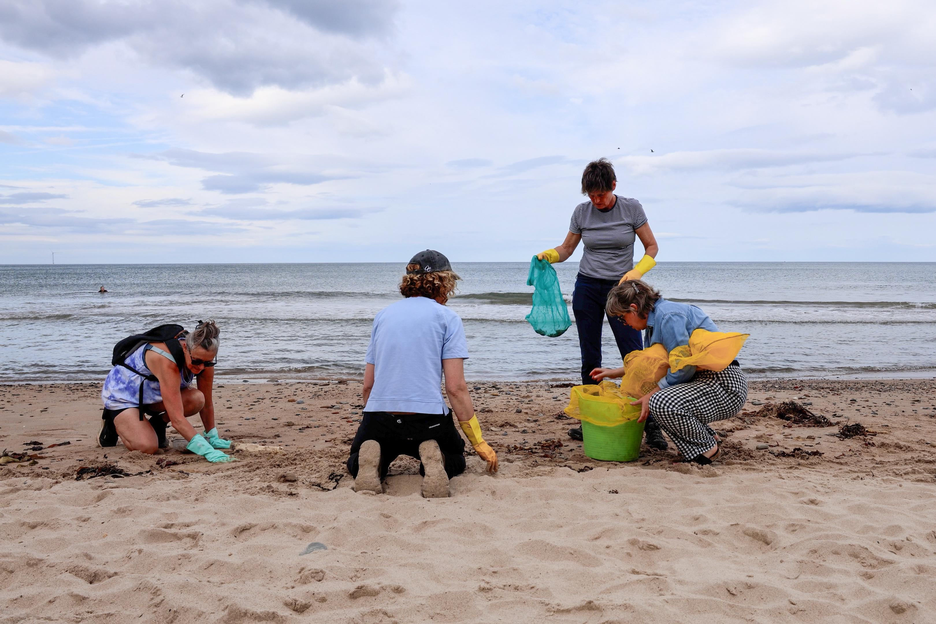 Volunteers cleaning the beach at Whitley Bay