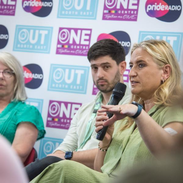 Panel Member speaking with microphone