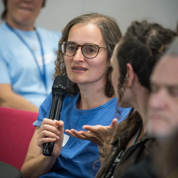 Person asking a question from the audience