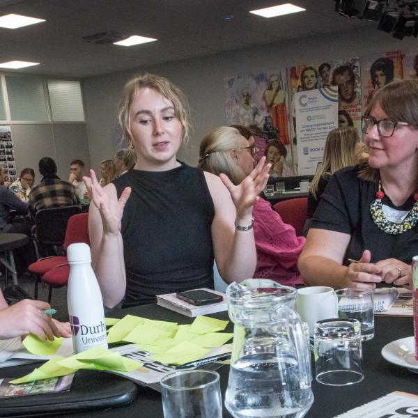 Smiling and expressive chat in a workshop
