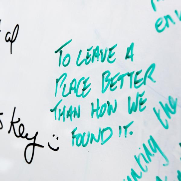written on a whiteboard: To leave a place better than we found it